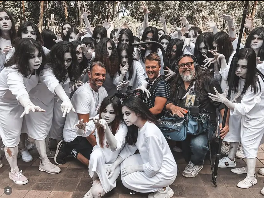 On-set production crew surrounded by performers